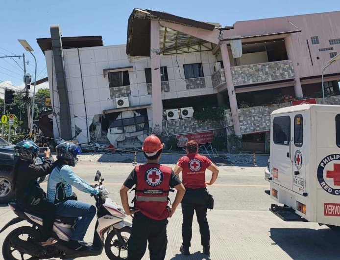 A 7.8 magnitude quake in the Philippines kills at least 19, fells buildings and sets off a tsunami